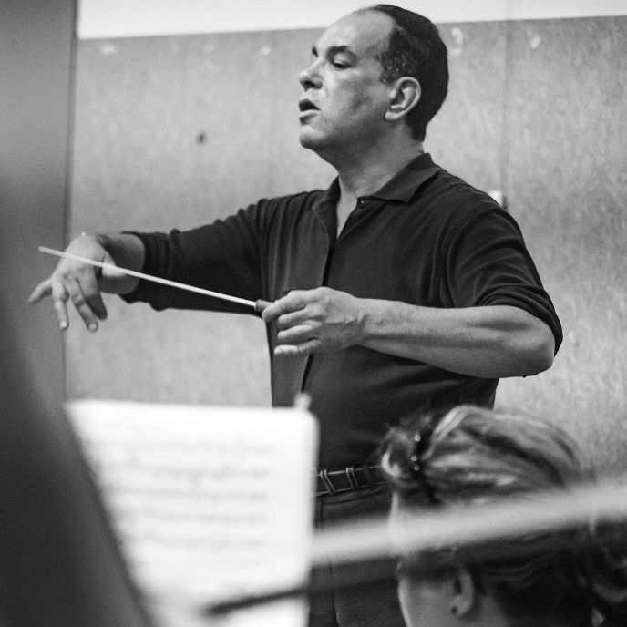 Simon Romanos conducting the opera Don Giovanni in Wellington, New Zealand